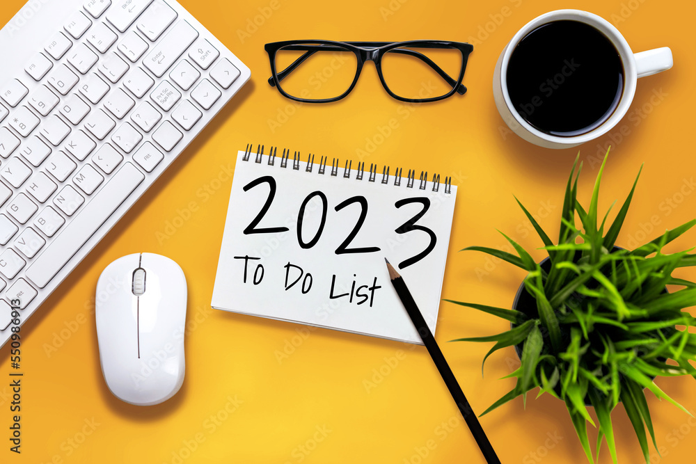 2023 Happy New Year Resolution Goal List and Plans Setting - Business office desk with notebook writ