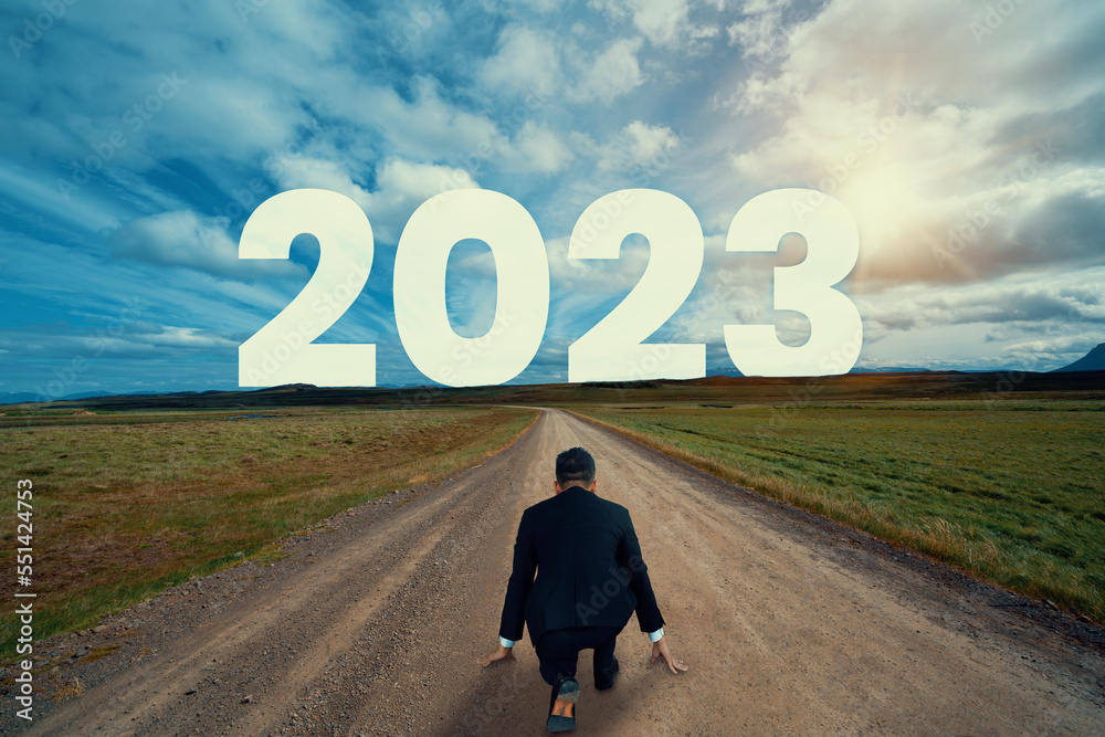 The 2023 New Year journey and future vision concept . Businessman traveling on highway road leading 