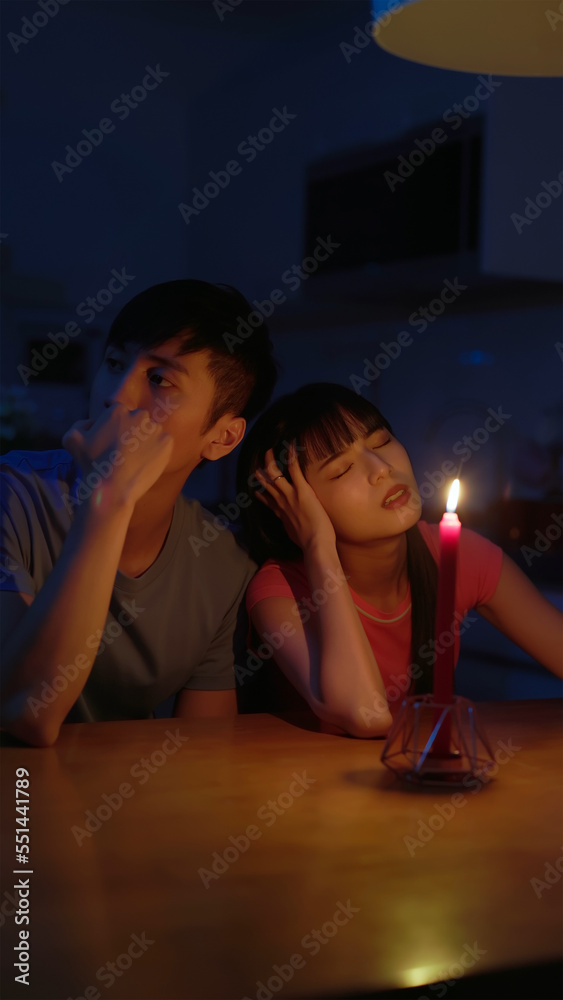 asian couple with power outage