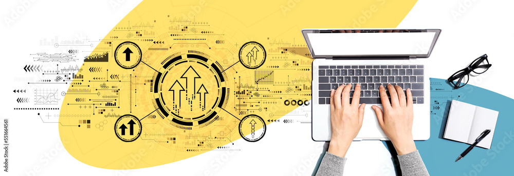 Rising arrow theme with person using a laptop computer