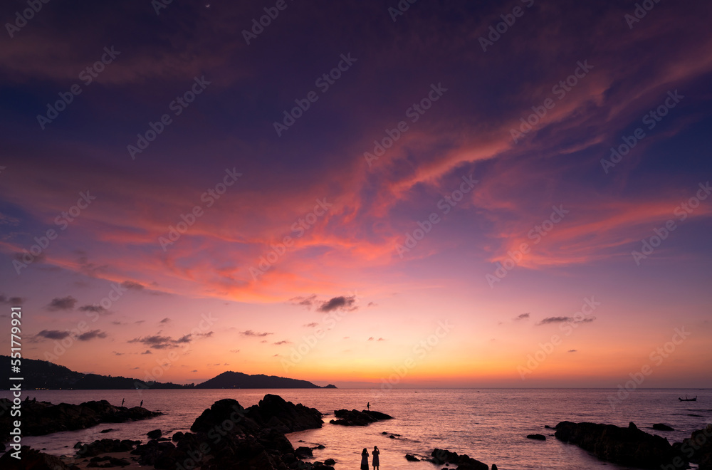 Landscape Long exposure of majestic clouds in the sky sunset or sunrise over sea with reflection in 