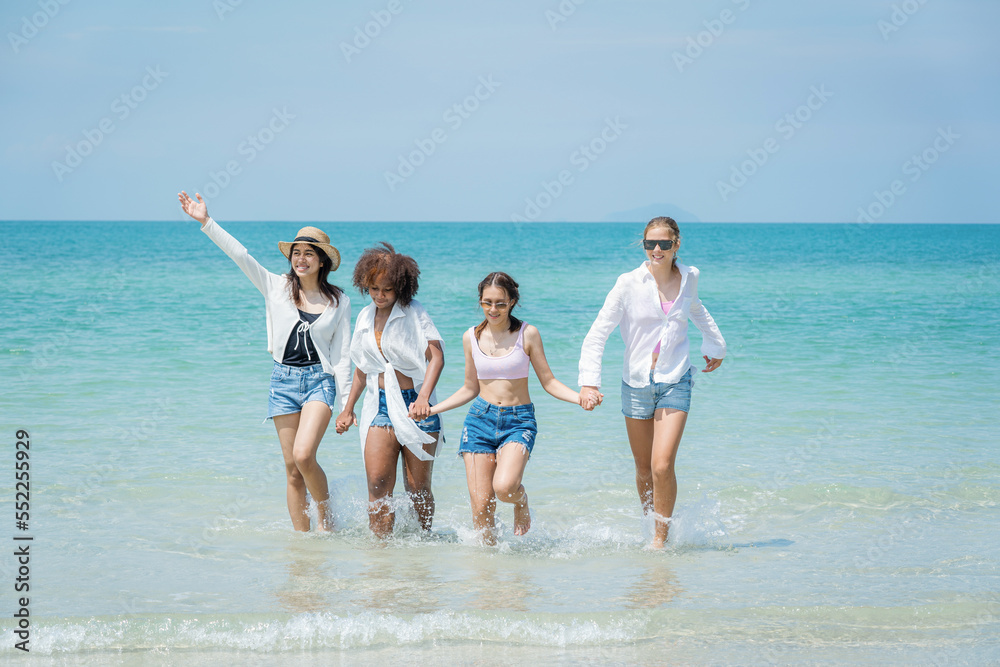 Happy female friends enjoy and fun outdoor activity lifestyle on holiday travel vacation at the sea.