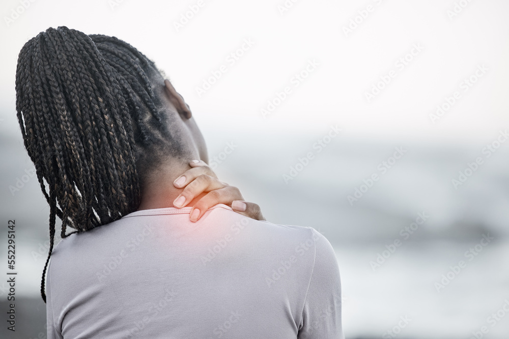 Black woman, neck and back pain on beach for fitness exercise, body wellness or sports training outd