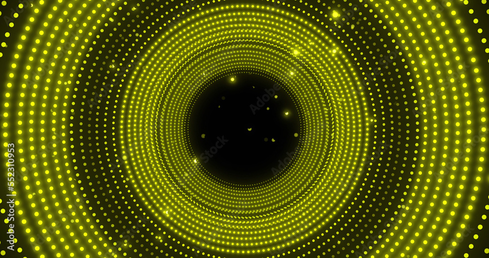 Image of glowing yellow spots in circular movement on black background