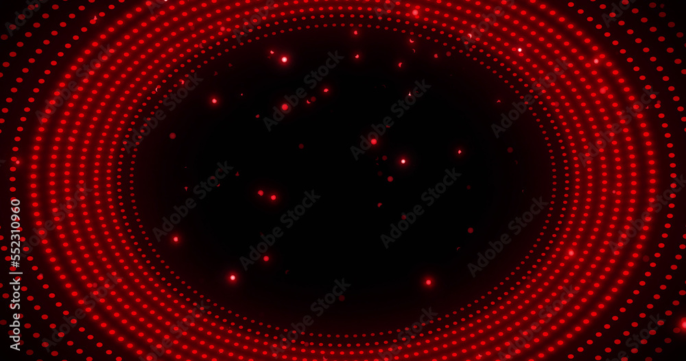 Image of glowing red spots in circular movement on black background