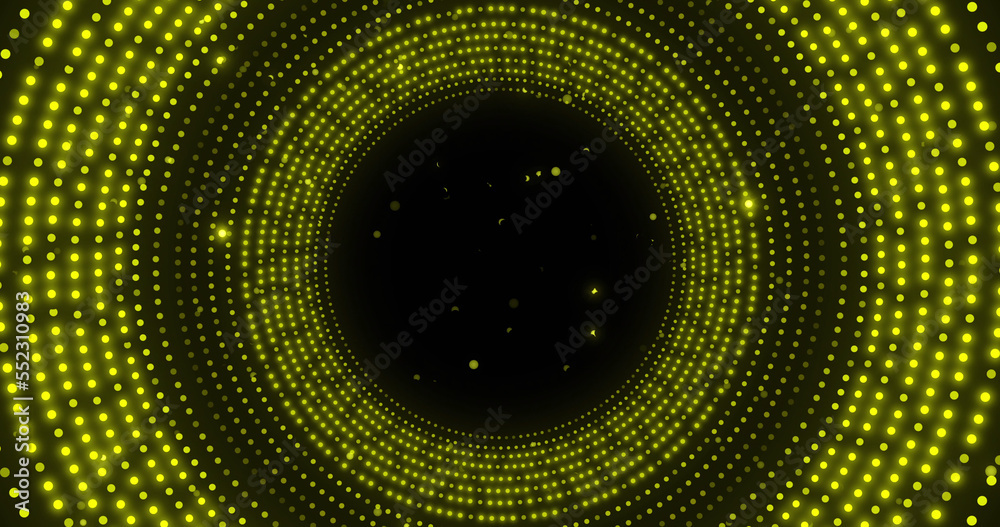 Image of glowing yellow spots in circular movement on black background