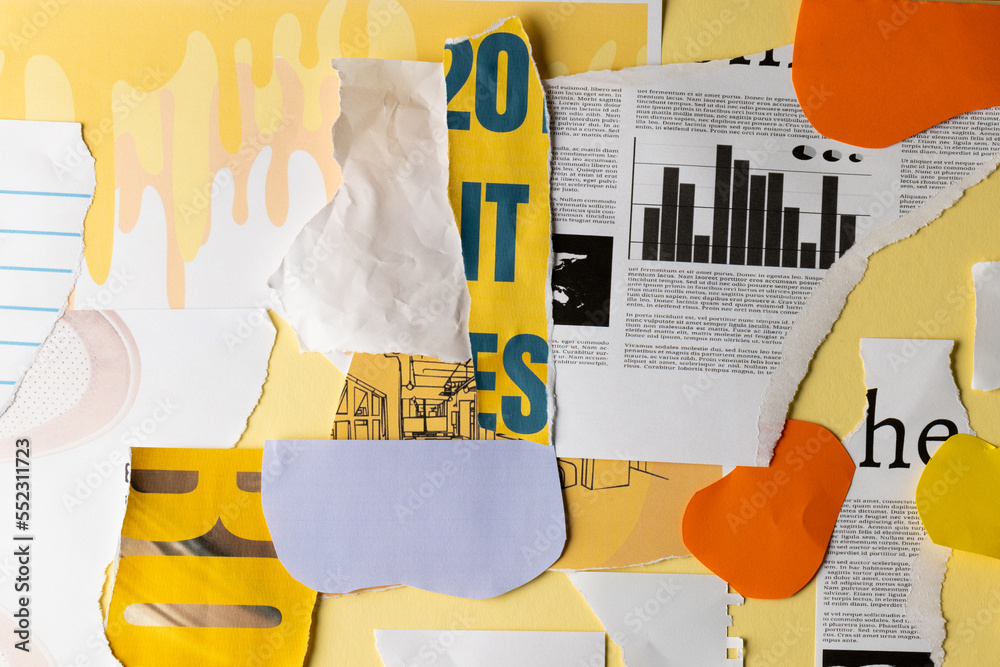 Ripped up pieces of notebooks, newspaper and coloured paper with copyspace on yellow background