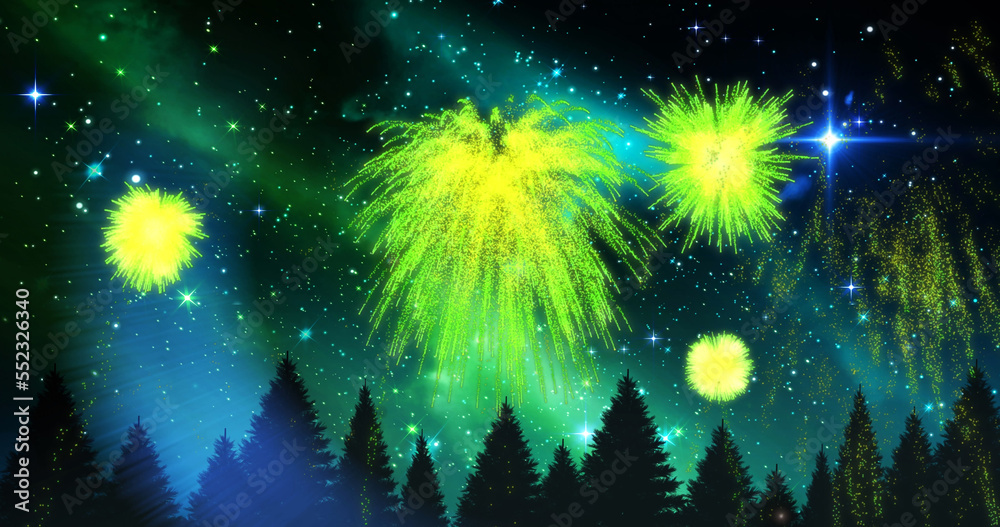 Image of green christmas and new year fireworks exploding over trees in starry night sky