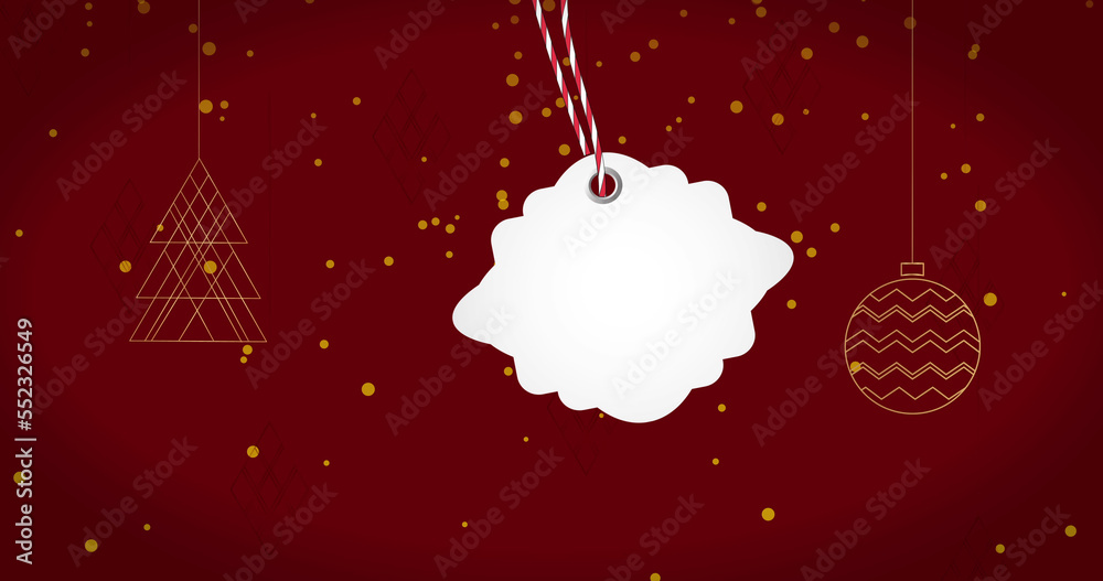 Image of gift tag with copy space over christmas baubles and light spots on red background