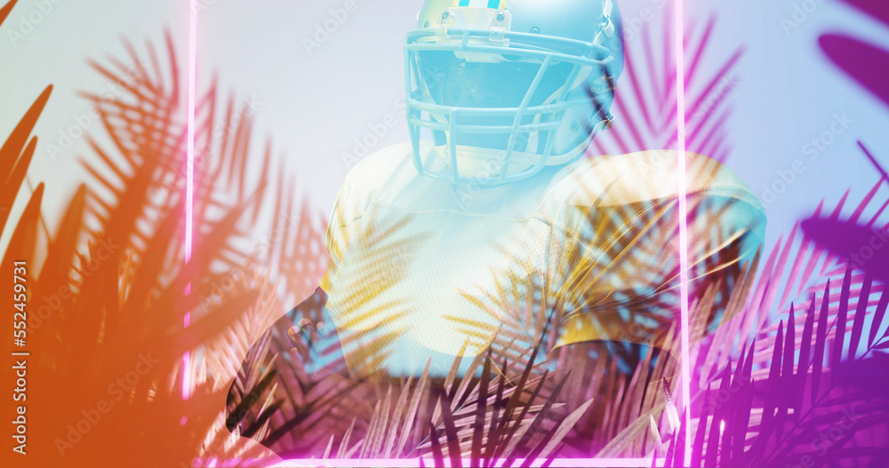 Close-up of american football player by illuminated rectangle shape and plants