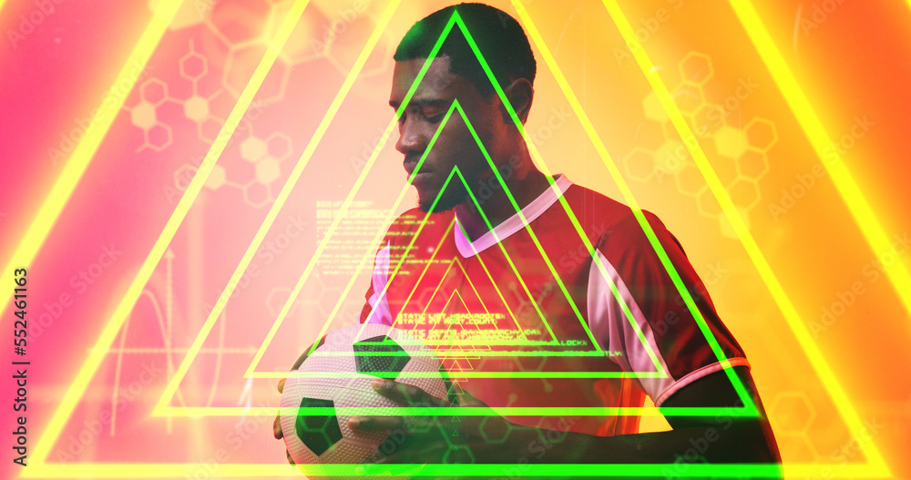 Illuminated triangles and hexagons over thoughtful african american male soccer player with ball