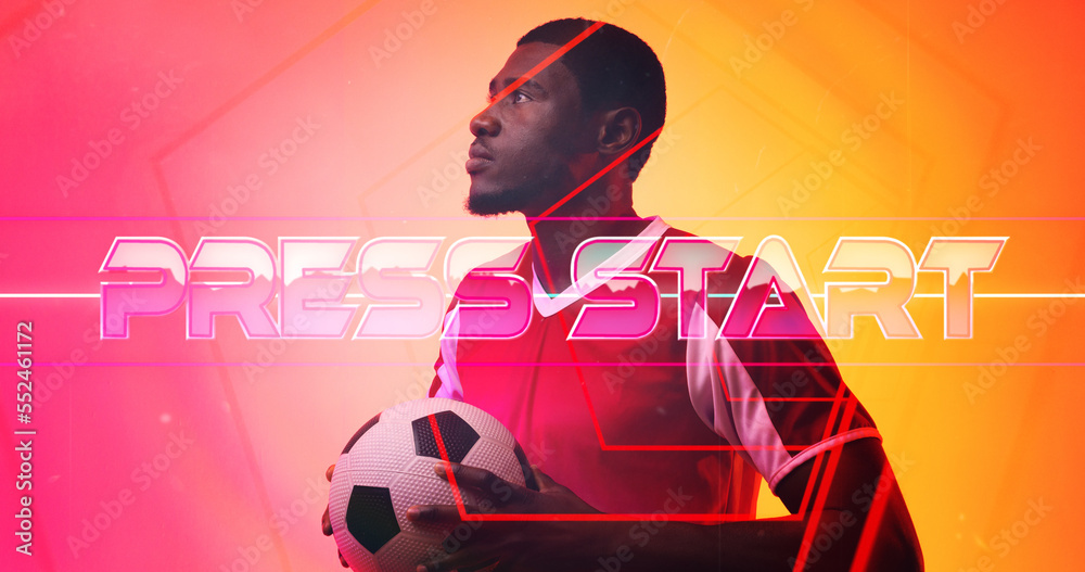 Illuminated press start text and lines over thoughtful african american male soccer player with ball