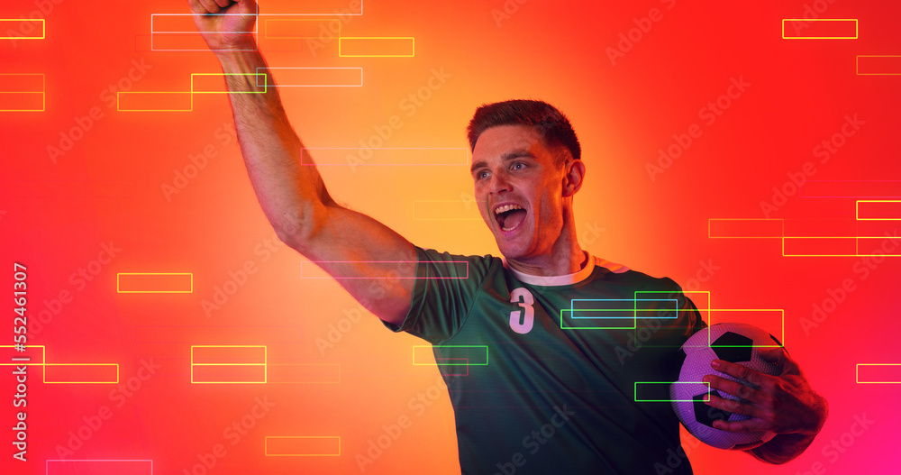 Composite of young caucasian soccer player celebrating success over orange background, copy space