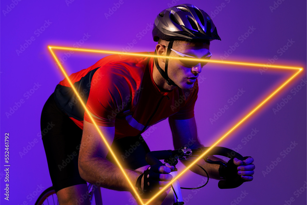 Triangle neon over confident biracial young male cyclist riding bicycle against purple background