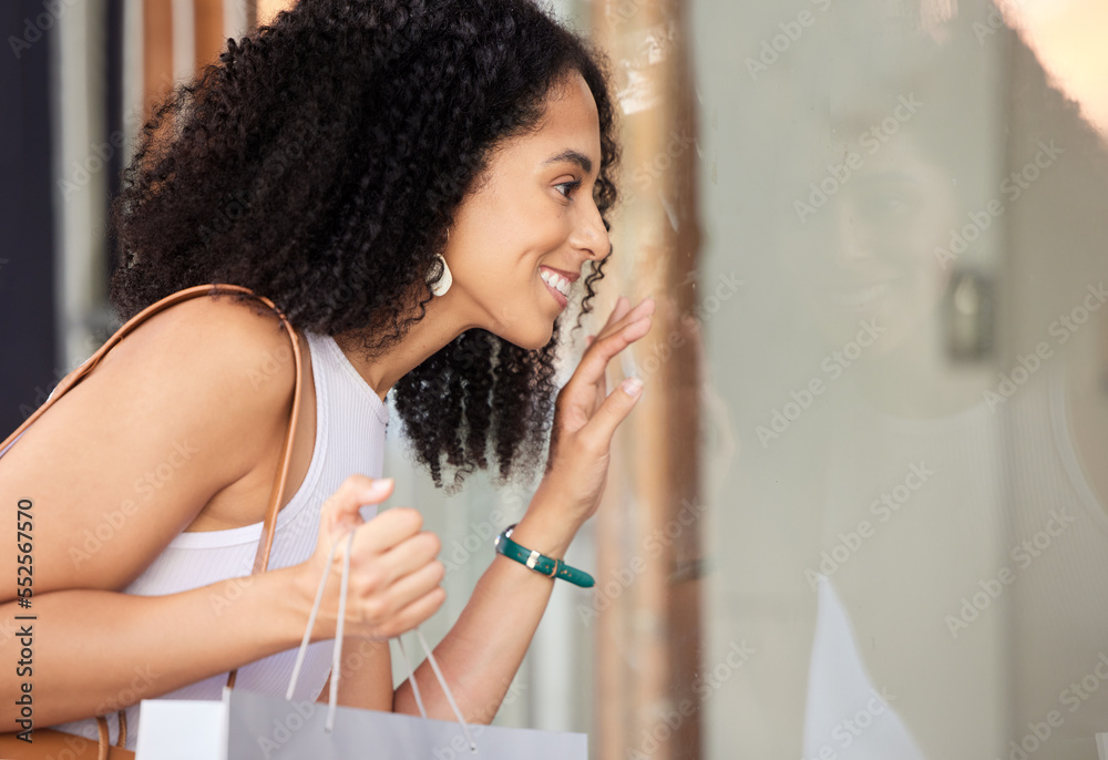 Window shopping, black woman and shopping mall store with a customer looking at sale and discount. R