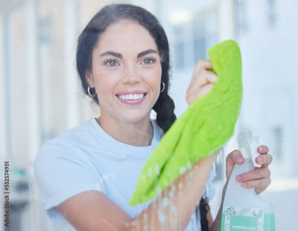 Happy, woman and cleaning home window with cloth and detergent product to polish glass. Spring clean