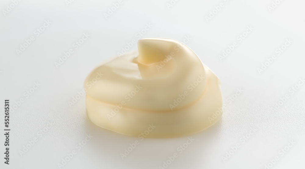 Mayonnaise swirl close up. Handful of home made healthy vegan mayonnaise on white background. White 