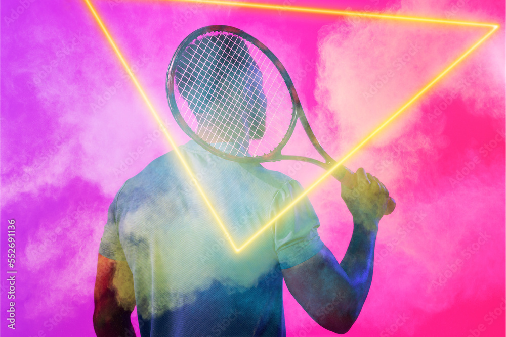 Rear view of african american male tennis player with racket amidst smoke by glowing triangle