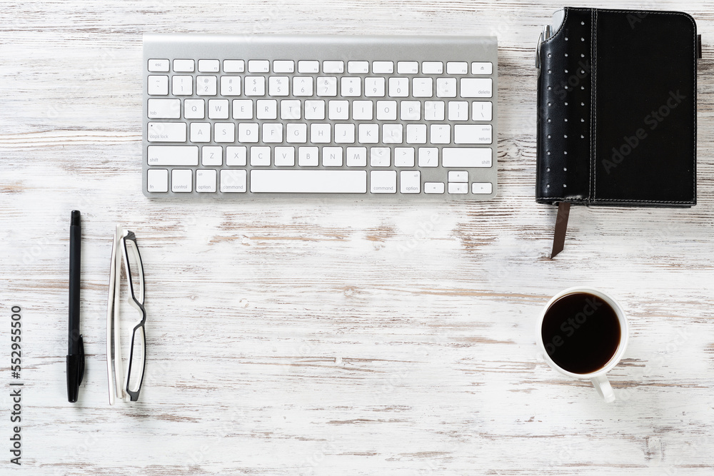 Still life of office workspace with cup of coffee