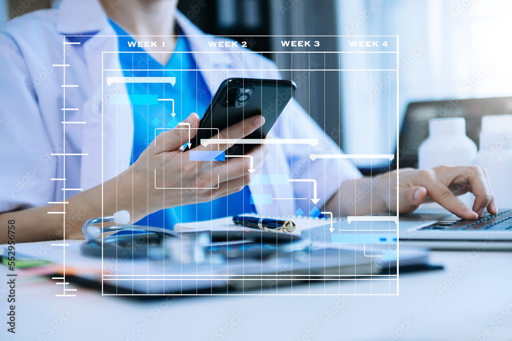 Project manager working and update tasks with Gantt chart scheduling diagram at hospital .success sm