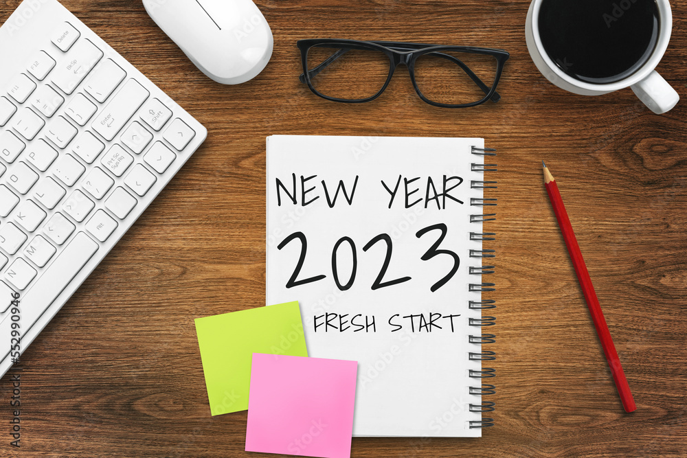 2023 Happy New Year Resolution Goal List and Plans Setting - Business office desk with notebook writ