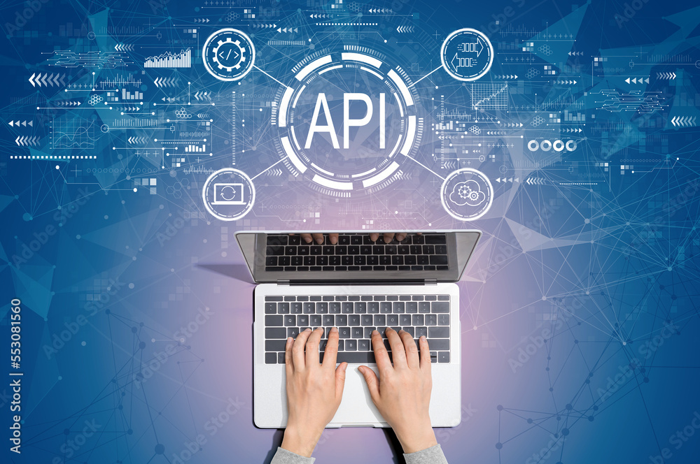 API - application programming interface concept with person using a laptop computer