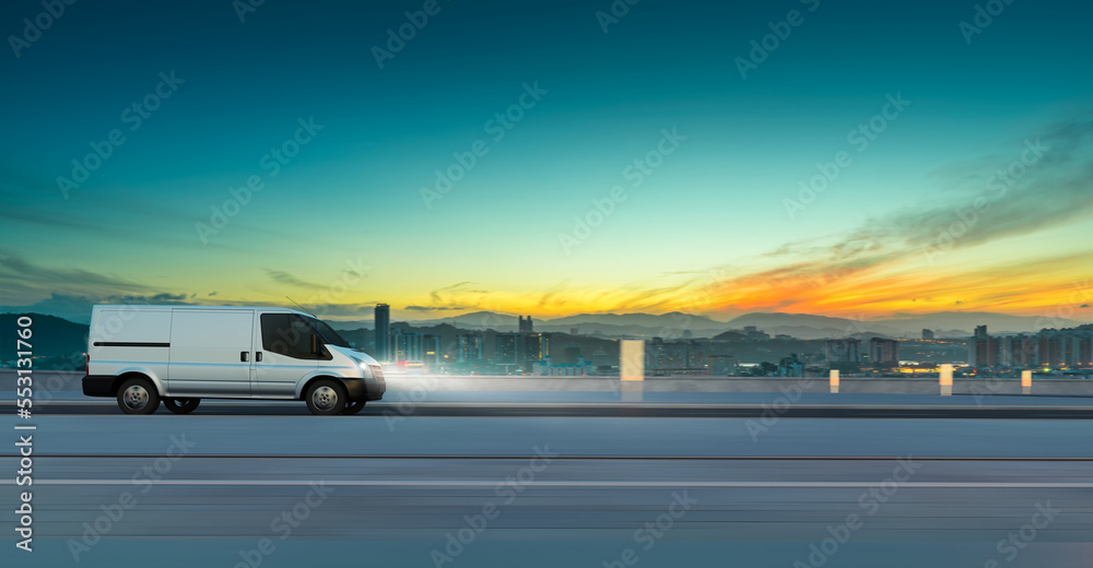 Van delivery on road at sunrise