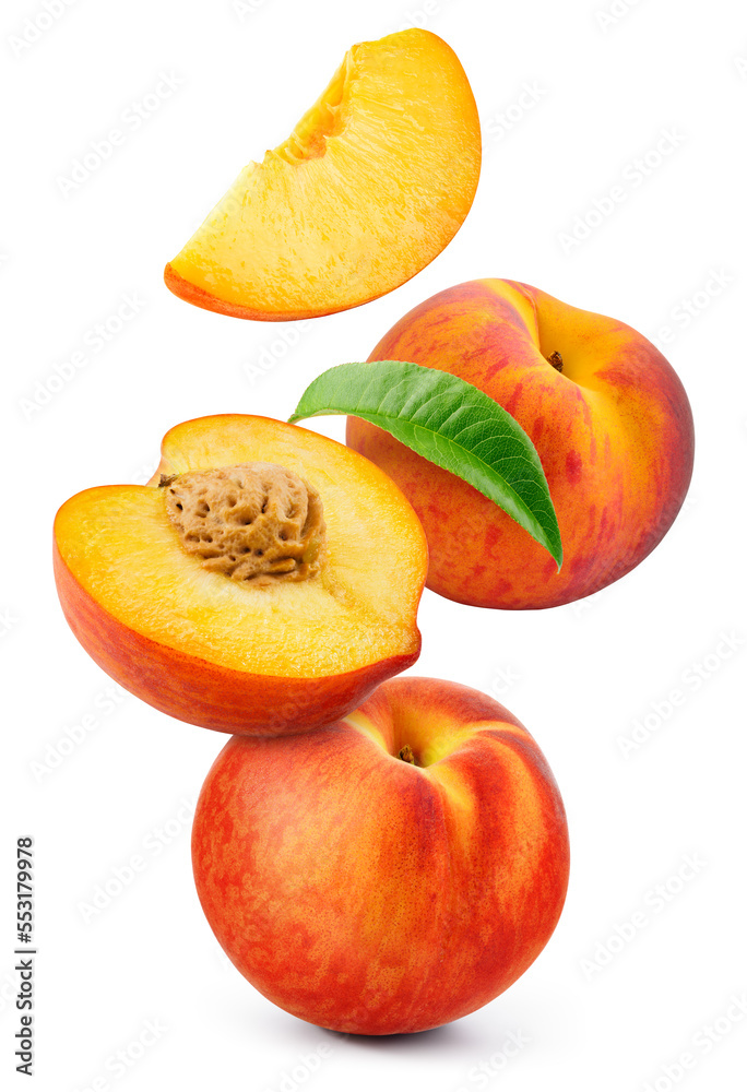 Peach isolated. Whole peach flying with a slice on white background. Falling peach fruit with leaf a