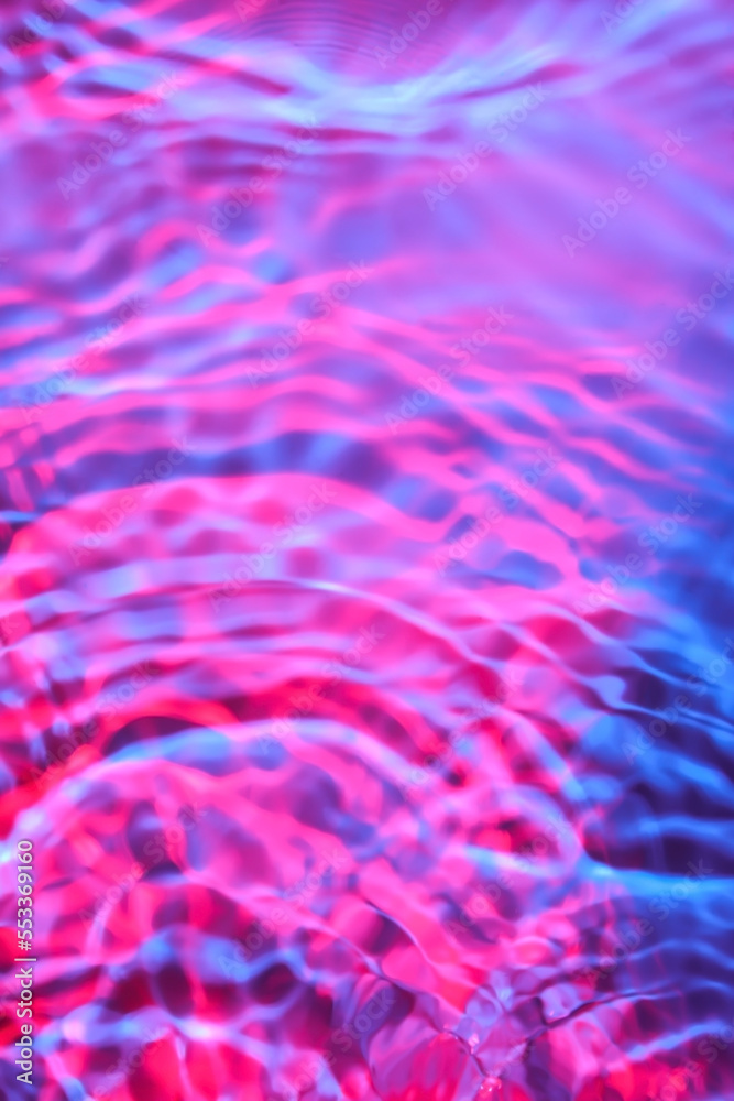 Texture of water with ripples on color background