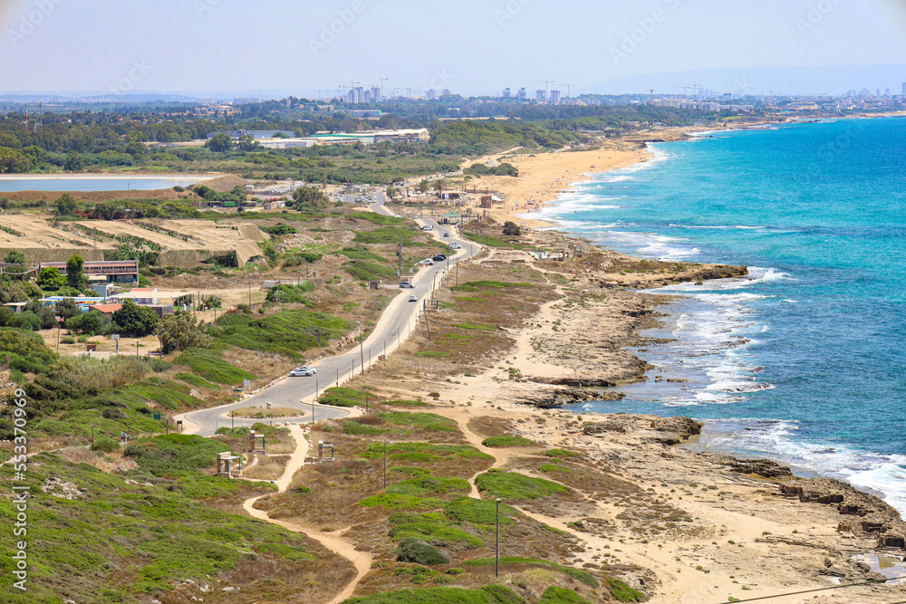 Beautiful view of road near sea shore on sunny day