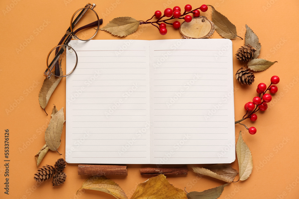 Composition with blank notebook, eyeglasses and natural forest decor on color background