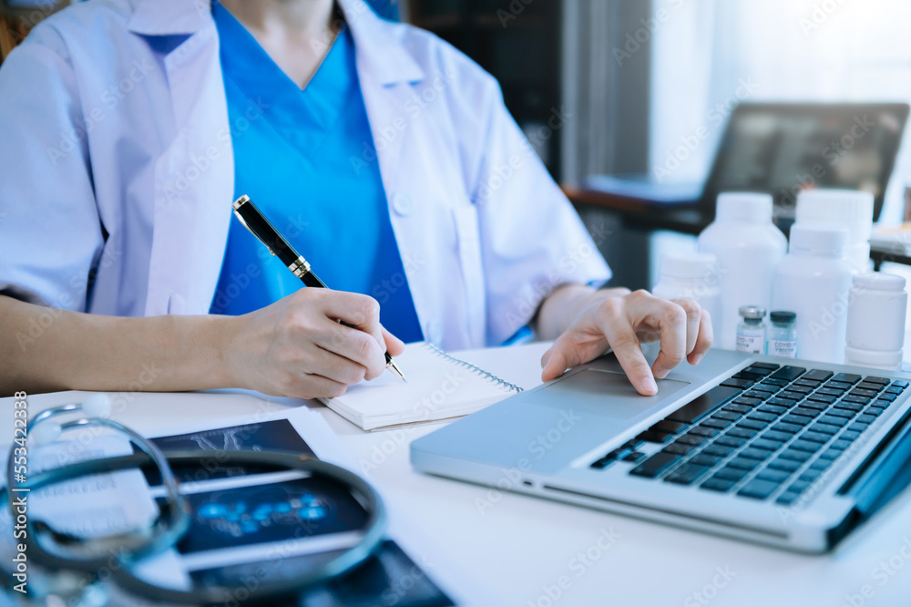 Medical technology concept. Doctor working with mobile phone and stethoscope and digital tablet lapt