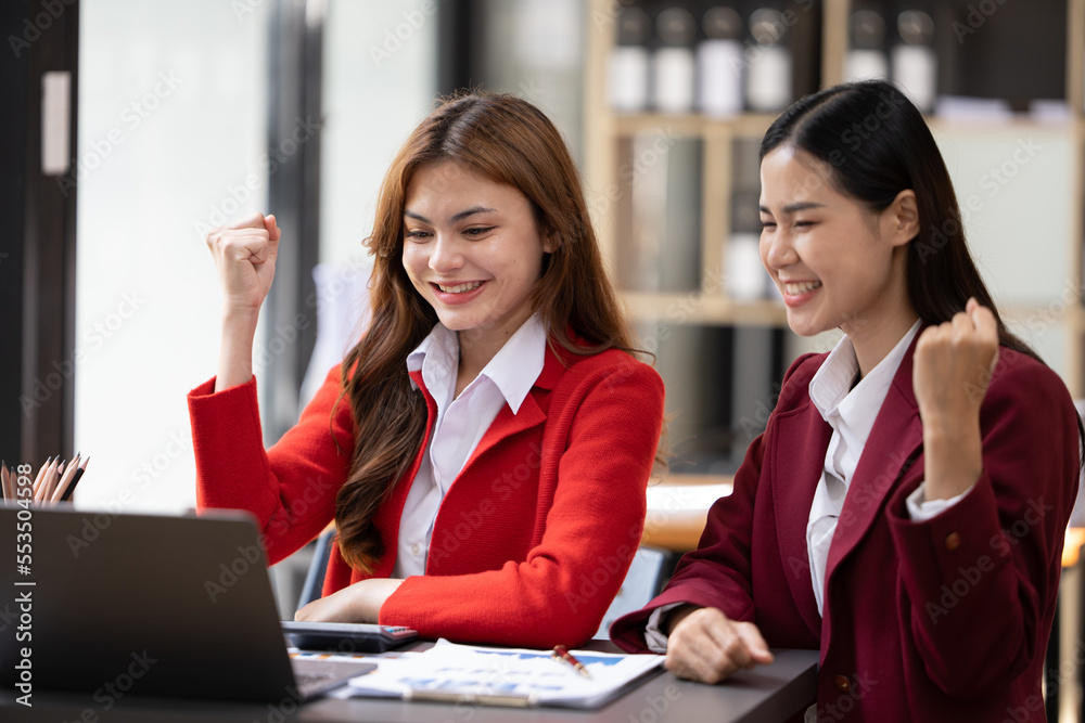 Excited concept, Happy young woman high fiving with colleague in office.