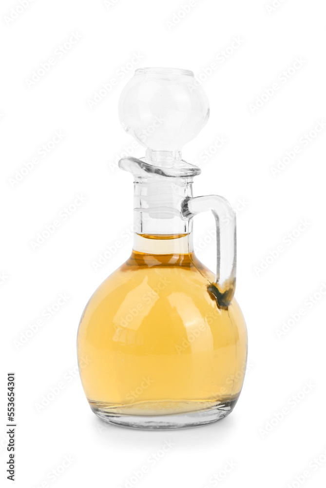 Decanter of apple cider vinegar on white background