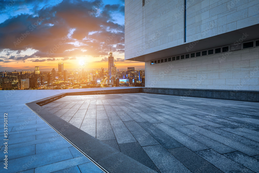 Empty square floor and modern city skyline with buildings at sunset in Ningbo, Zhejiang Province, Ch