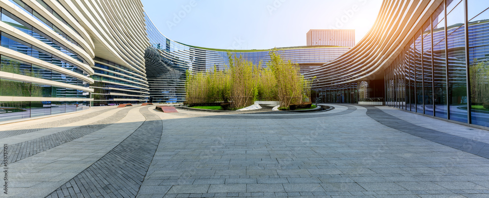 Empty square floor with modern commercial architecture background