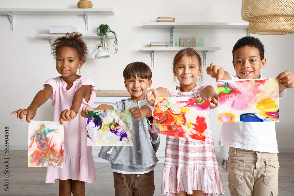 Little children with paintings in workshop for Ebru