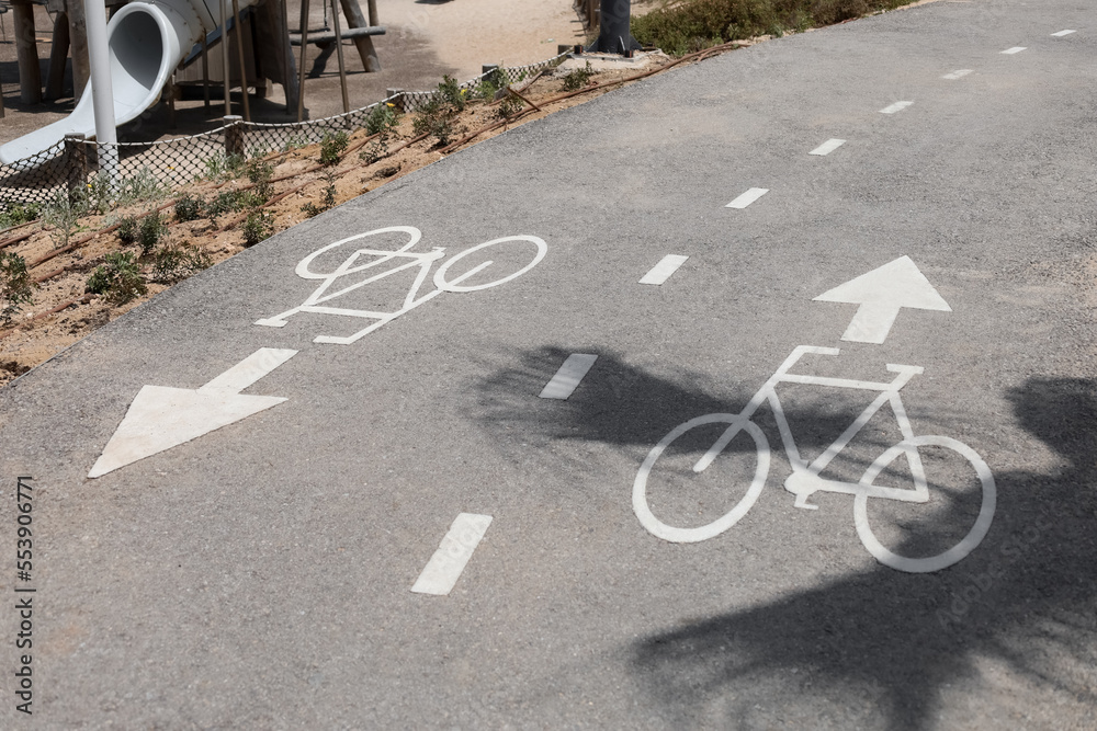 Bicycle signs on road in city