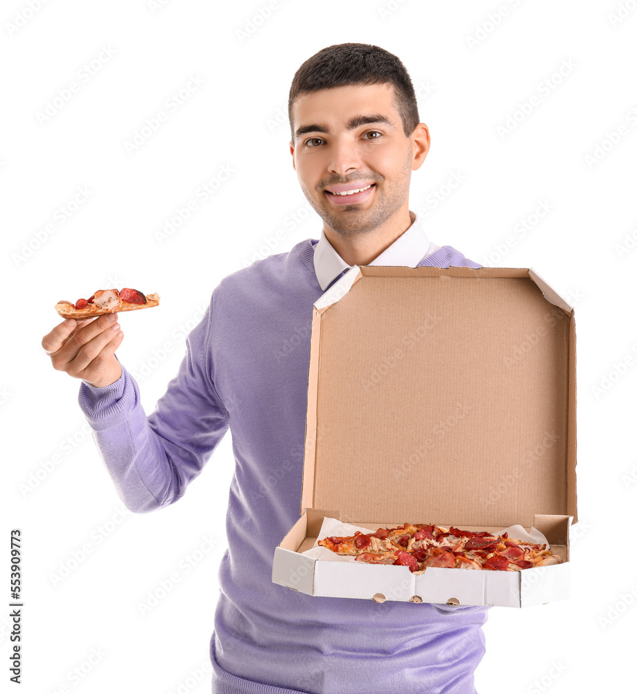 Handsome young man holding box with fresh pizza on white background