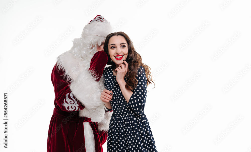 Man in costume of santa claus and beautiful girl on white background. Woman with santa claus togethe