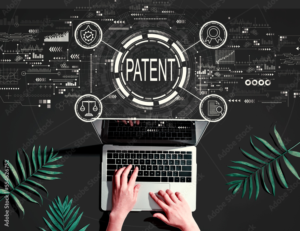 Patent concept with person using a laptop computer