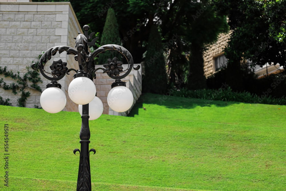 Street lantern in park on sunny day