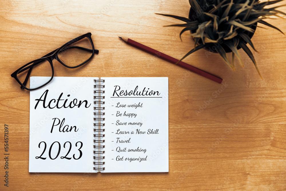 2023 Happy New Year Resolution Goal List and Plans Setting - Business office desk with notebook writ