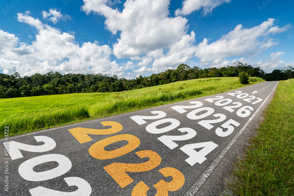 2023 New Year road trip travel and future vision concept . Nature landscape with highway road leadin