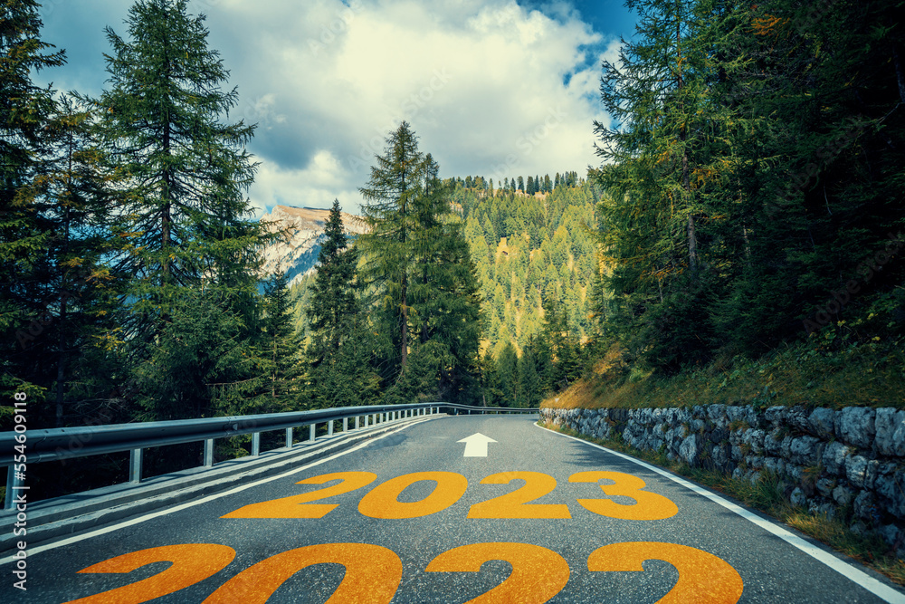 2023 New Year road trip travel and future vision concept . Nature landscape with highway road leadin