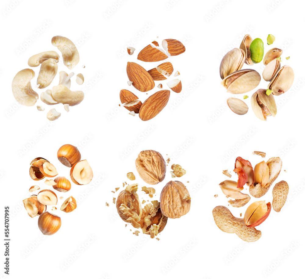 Set of various crushed dried nuts close-up in the air isolated on a white background