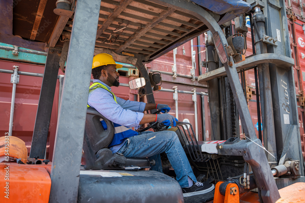 Foreman working at container stock yard with drive a loader forklift steering wheel control for tran