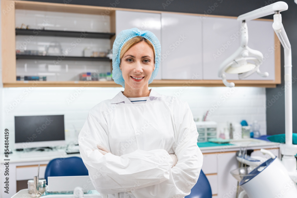 Portrait of Caucasian young dentist standing at dental health clinic. 