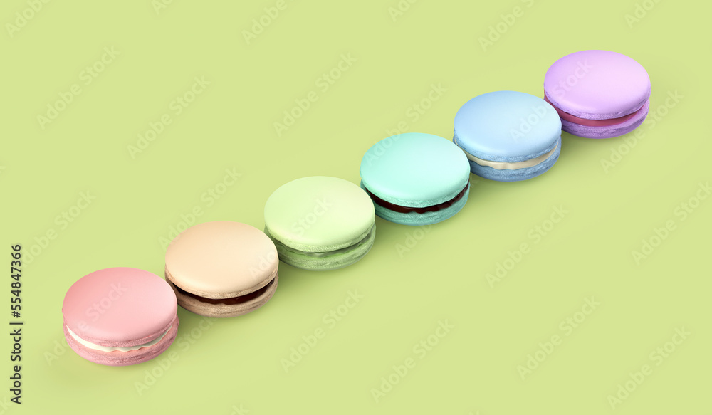 Six french macarons with different colors and flavors on green background