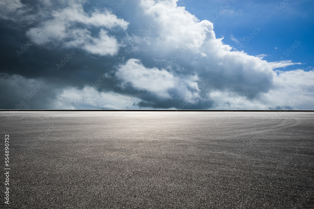 Asphalt road and sky clouds background